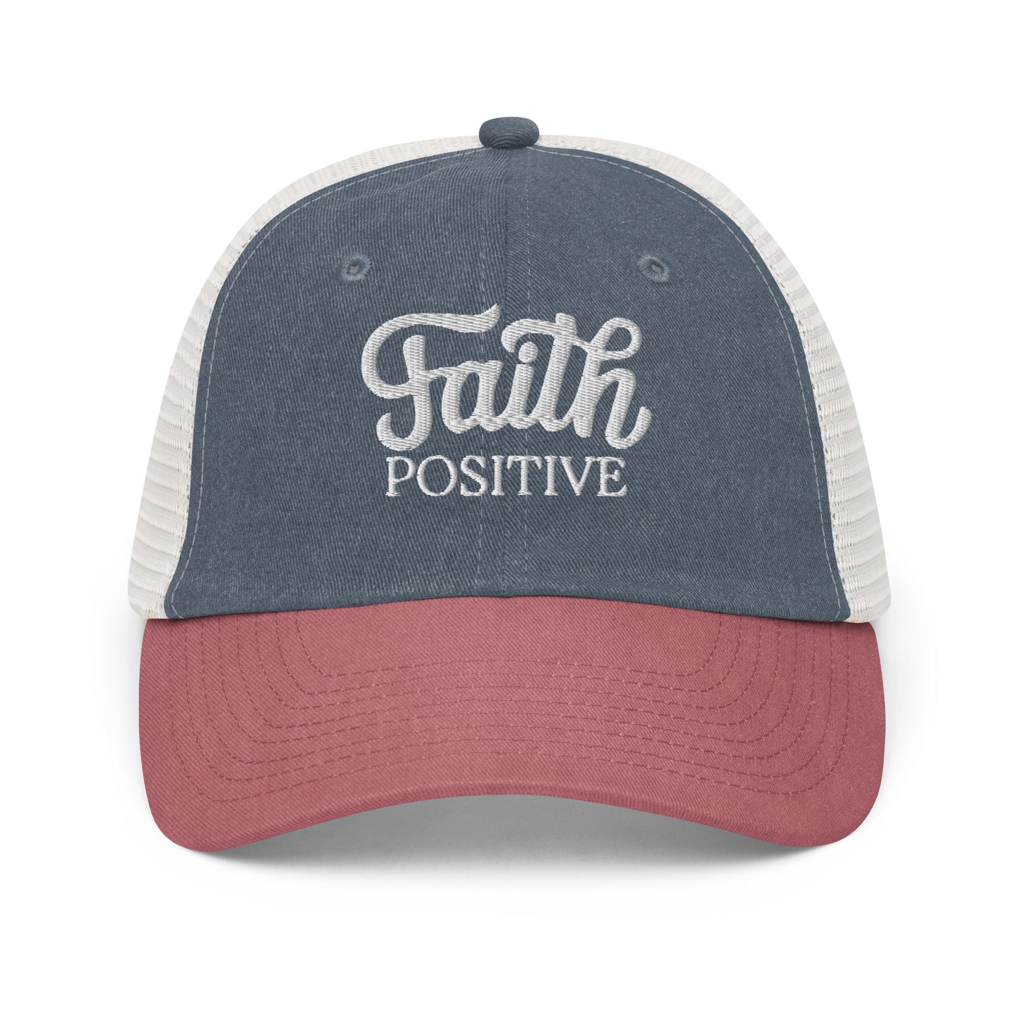 This is the Faith Positive low profile hat front view. The Faith Positive logo is embroidered on the front with white thread. This hat is pigment dyed, it has a mesh back, blue front and red bill. 