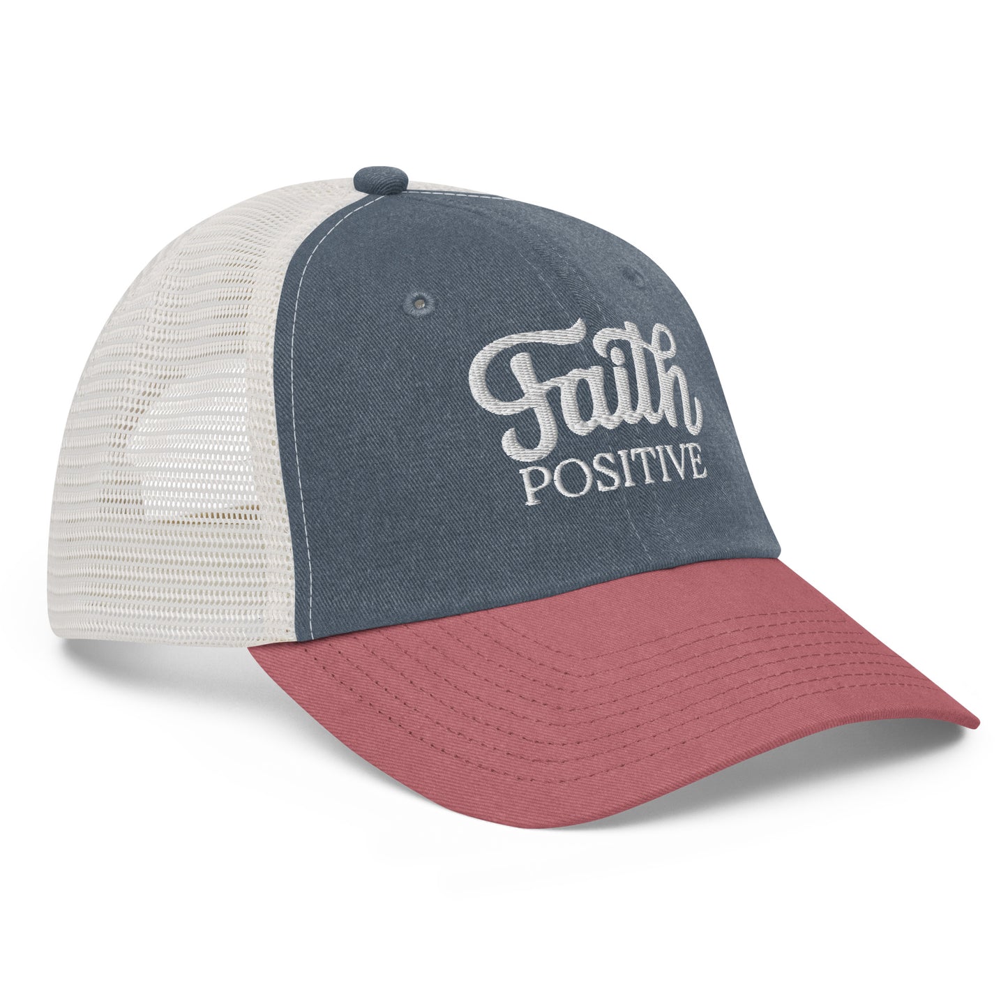This is the Faith Positive low profile hat side view. The Faith Positive logo is embroidered on the front with white thread. This hat is pigment dyed, it has a mesh back, blue front and a red bill.