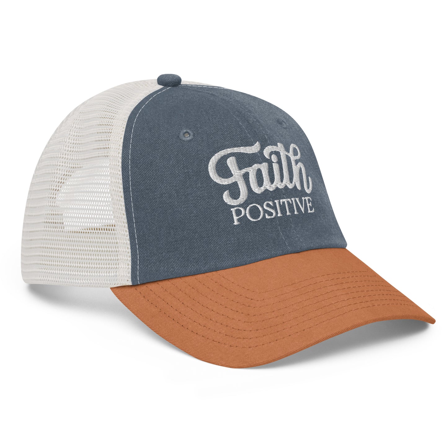 This is the Faith Positive low profile hat. The Faith Positive logo is embroidered on the front with white thread. This hat is pigment dyed, it has a mesh back, blue front and orange bill. This is the side view of the product.